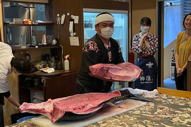 Tuna Cutting Show in Tokyo & Unlimited Sushi & Sake - Key Points
