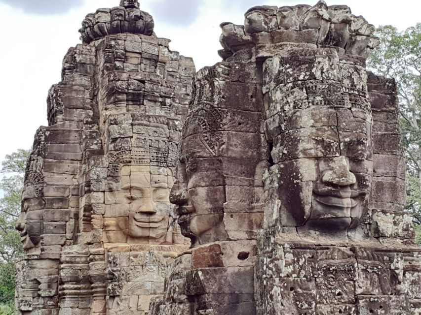 Angkor Sunrise, Taprohm and Angkor Thom. - Bayon Temple Smiling Faces