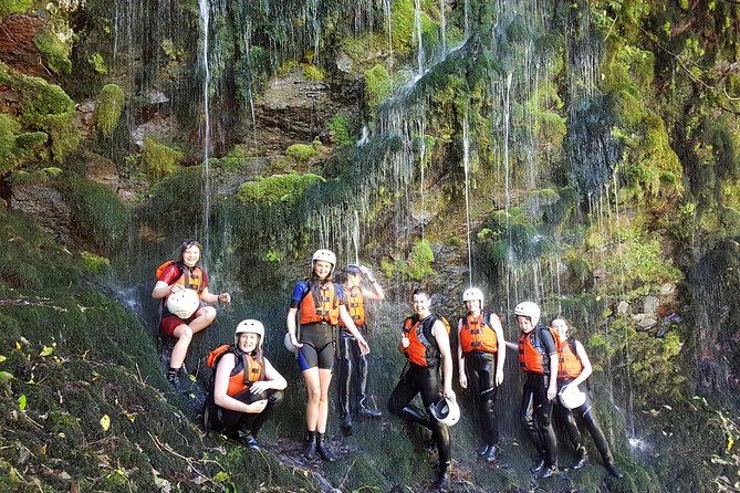 Rangitaiki River White Water Scenic Rafting From Rotorua - Bathing Under Waterfall